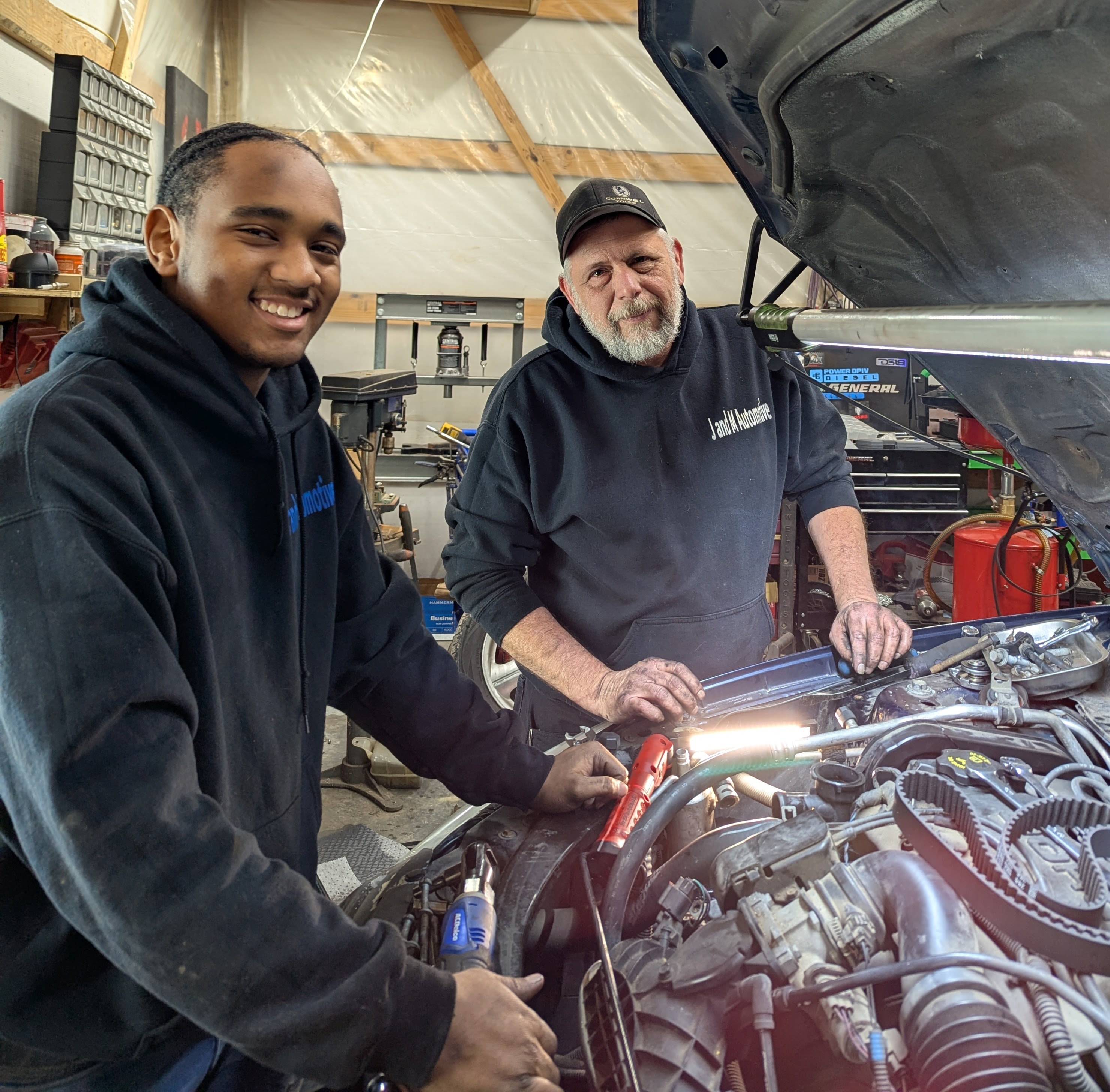 J and M Automotive team